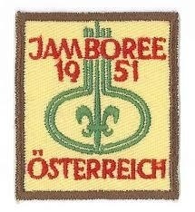 7th World Scout Jamboree â Austria 1951

Salzkammergut, Bad Ischl, Austria, 1951. 12,884 Scouts were present. Simplicity was the keynote of the Jamboree. Seven towers were erected, each recalling a previous Jamboree. As the name of each was announced, a flag was hoisted on one of the towers and the song of that Jamboree sung. It was the first time that German Scouts were able to take part in a World Scout Jamboree as full members of the World Organization. One Scout attended from Japan. He knew no language other than his own and the word "Jamboree", yet he made the journey with no problem. The sight of Scouts waving the welcome flags at the airport told him that he had arrived at the right place.