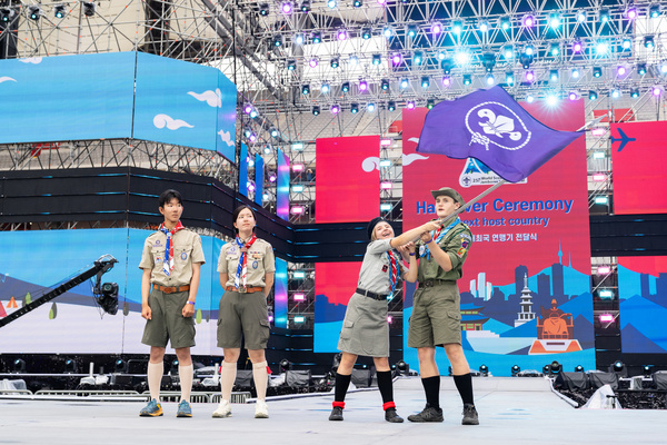 Poland receives the WOSM flag at the Closing Ceremony of the 25th World Scout Jamboree in the World Cup Stadium of Seoul, South Korea. Photo by Enrique Leon